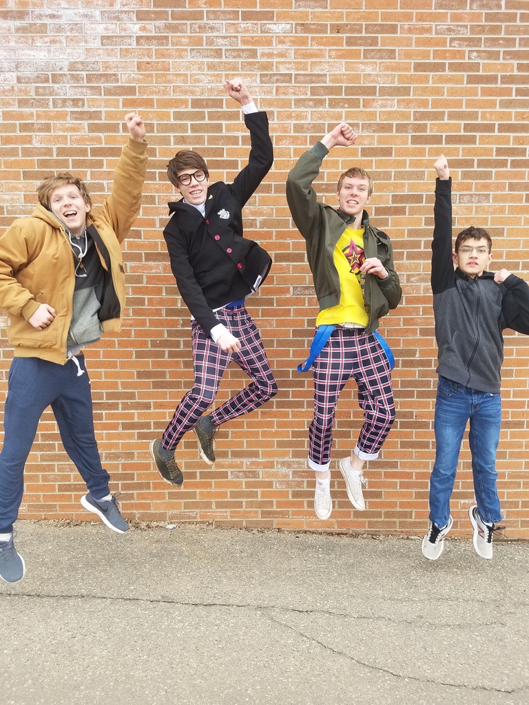 4 boys jumping for joy